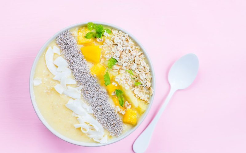 Mango,,Banana,,Pineapple,And,Oatmeal,Smoothie,In,The,Bowl,With
